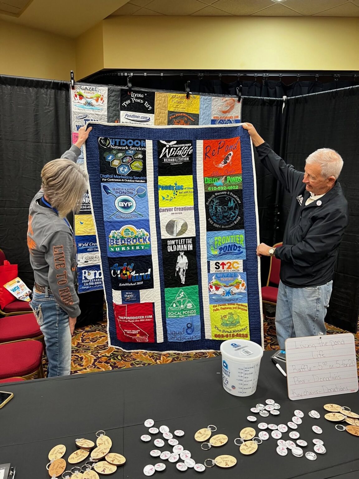 Exhibitor showing products to an attendee