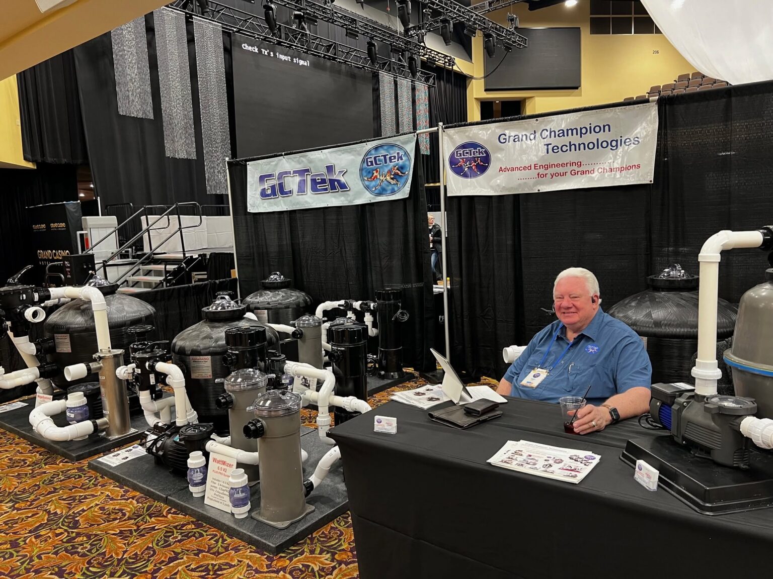Exhibitor talking with an attendee at a booth